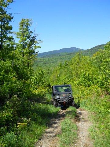 ATV riding trails in Carrabassett with mountains in the background